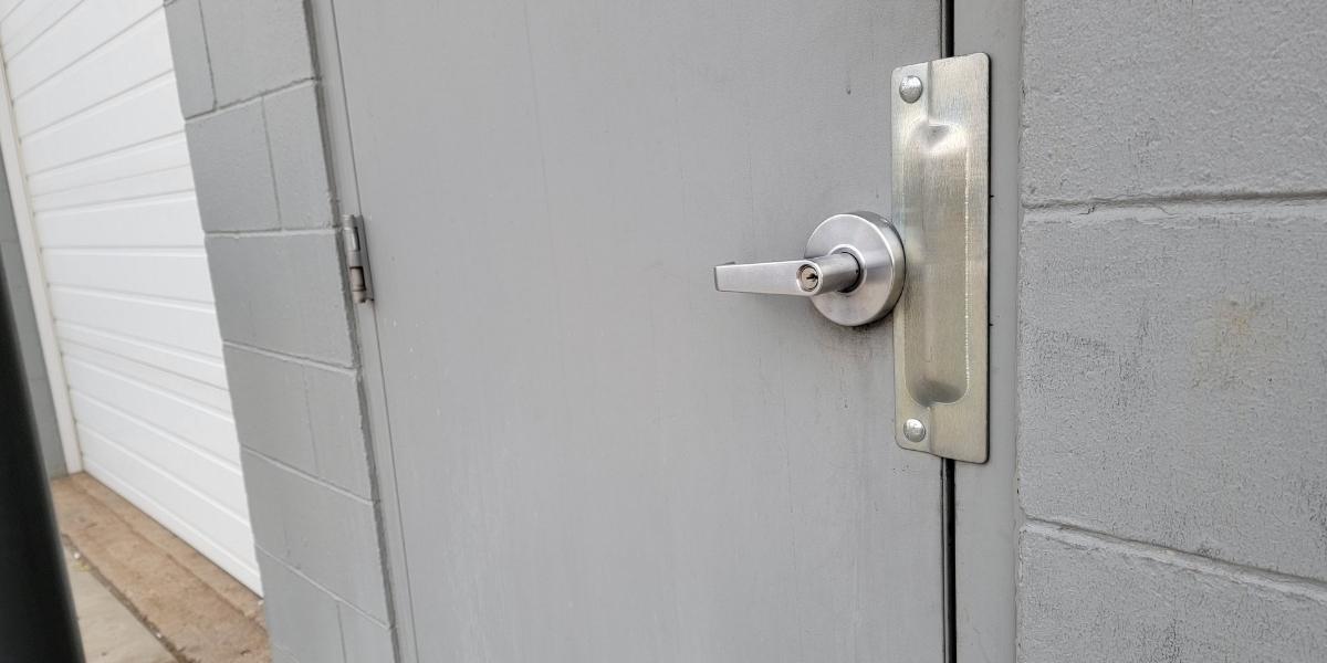 Latch-Gard LG110ZSFNP latch guard installed on outswing door, real photo